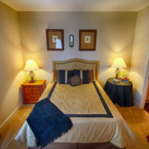 Apartment bedroom with on suite bathroom - The Legends Apartments