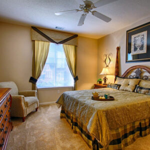 Large apartment bedroom with window - The Legends Apartments