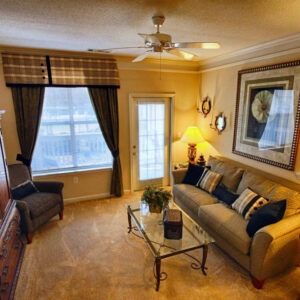 Large apartment living room with door to patio - The Legends Apartments
