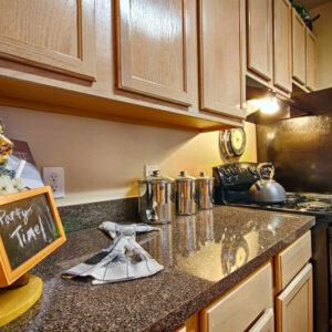 Updated apartment kitchen countertops and cabinets - The Legends Apartments