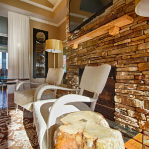 Fireplace and cozy living room space at our club house - The Legends Apartments
