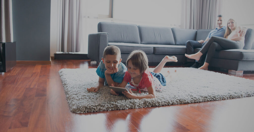 kids playing on carpet in living room