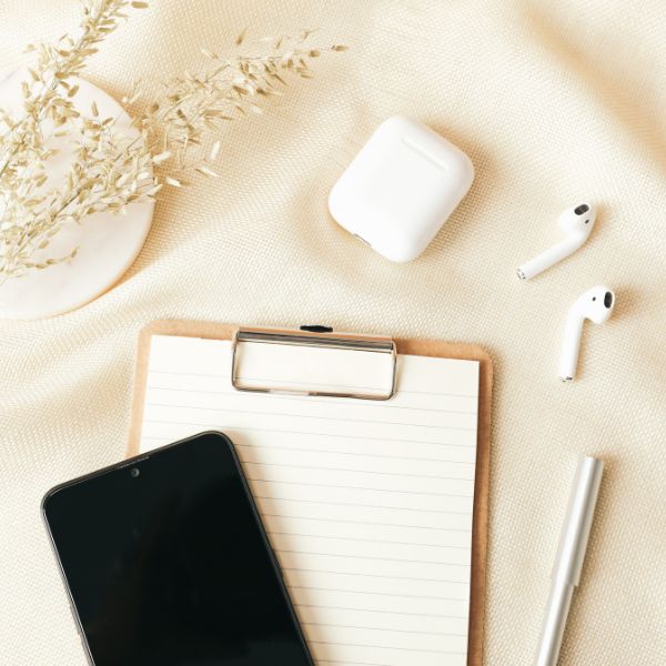 A phone next to a clipboard