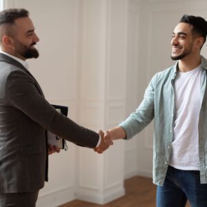 shaking hands with apartment agent