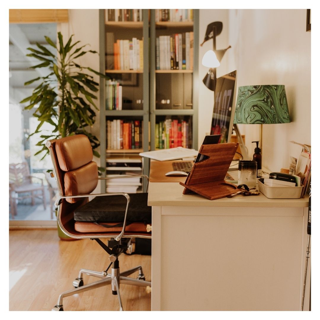 home office with desk, office chair, and bookshelf