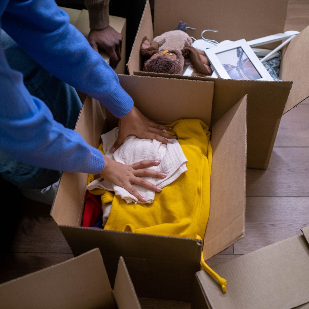 packing clothes in boxes
