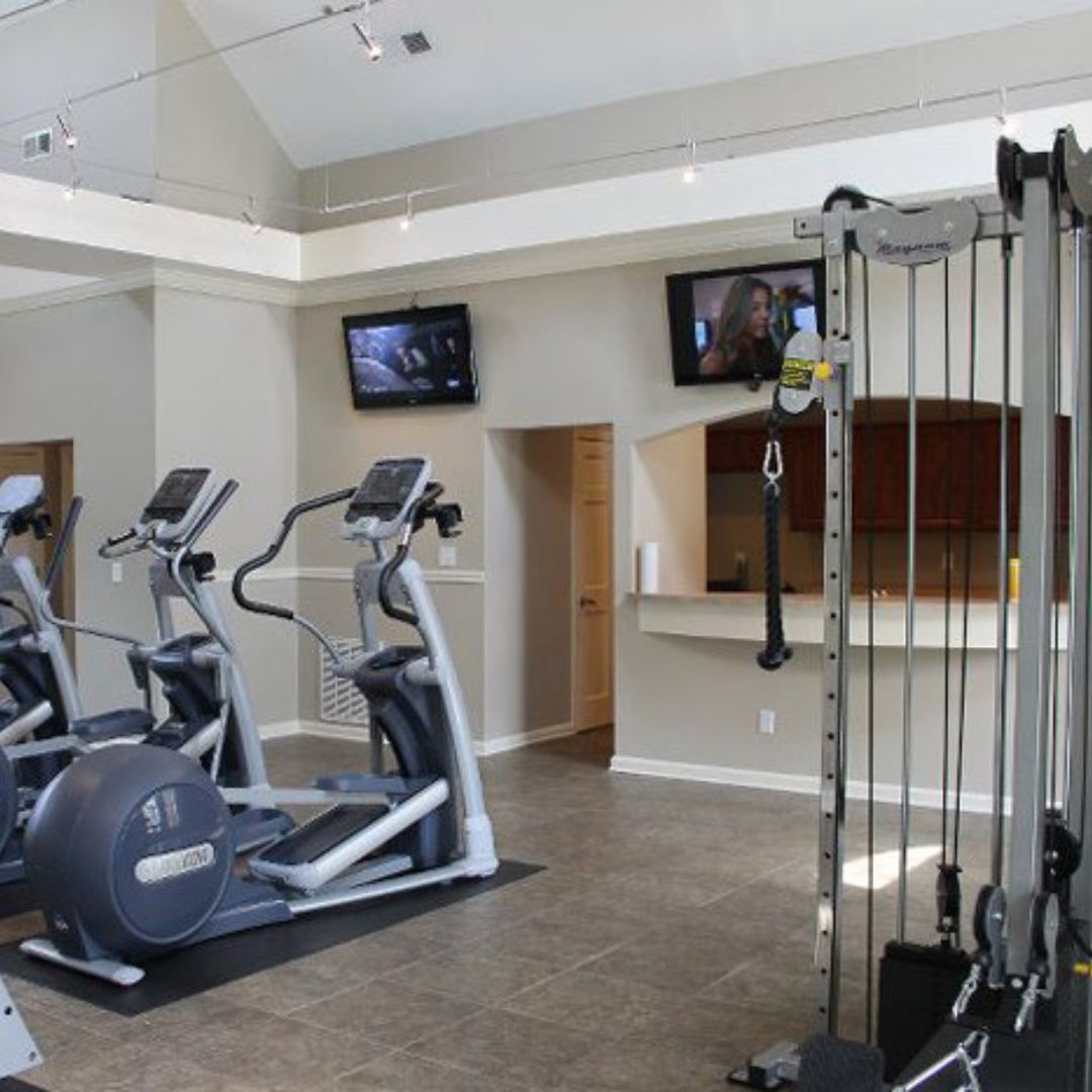 treadmills with TVs in apartment gym