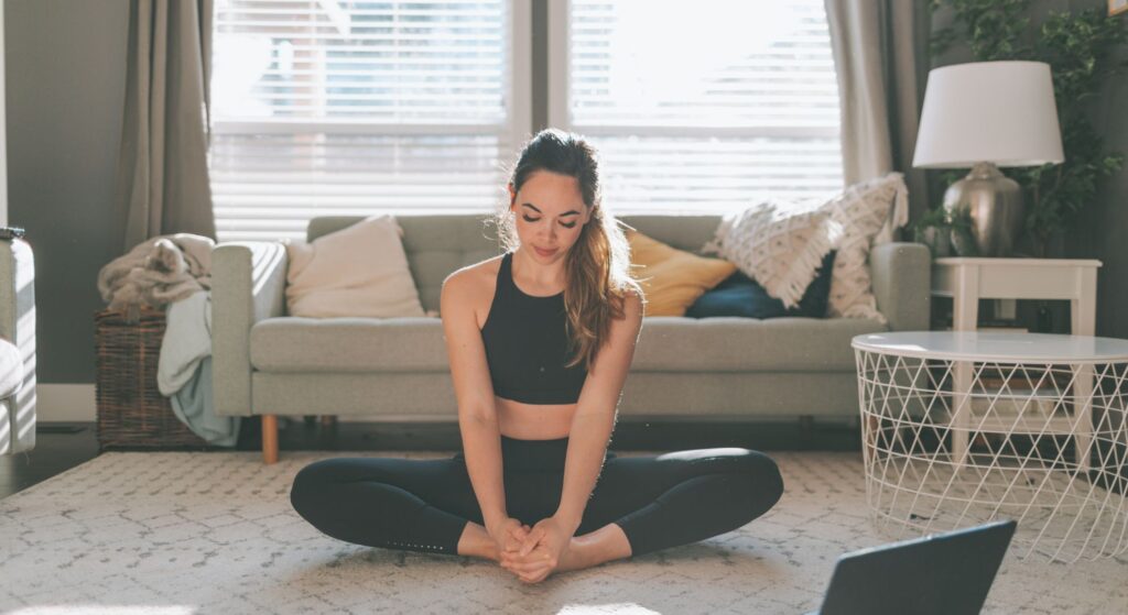 woman stretching at home