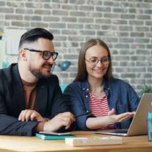 Couple looking up floor plans