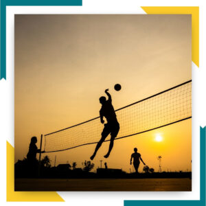 Silhouette of people playing volleyball