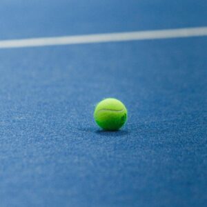 close up of a tennis ball on court